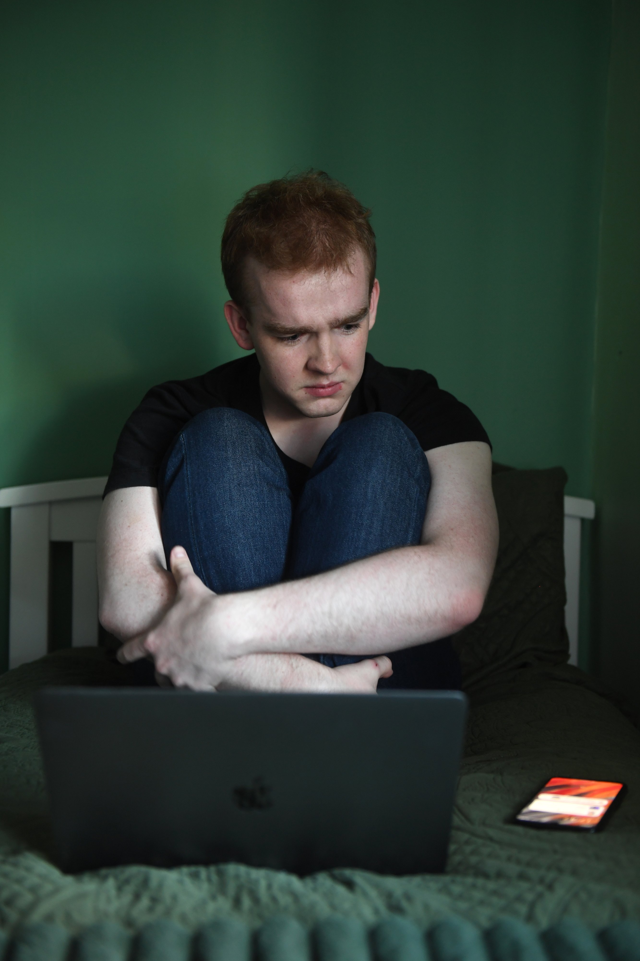 Worried young man with laptop