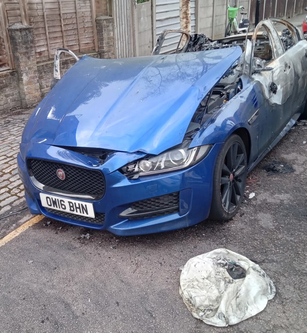 Burnt-out blue Jaguar