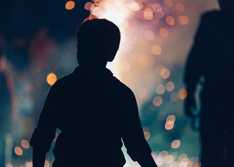 Little boy watching fireworks